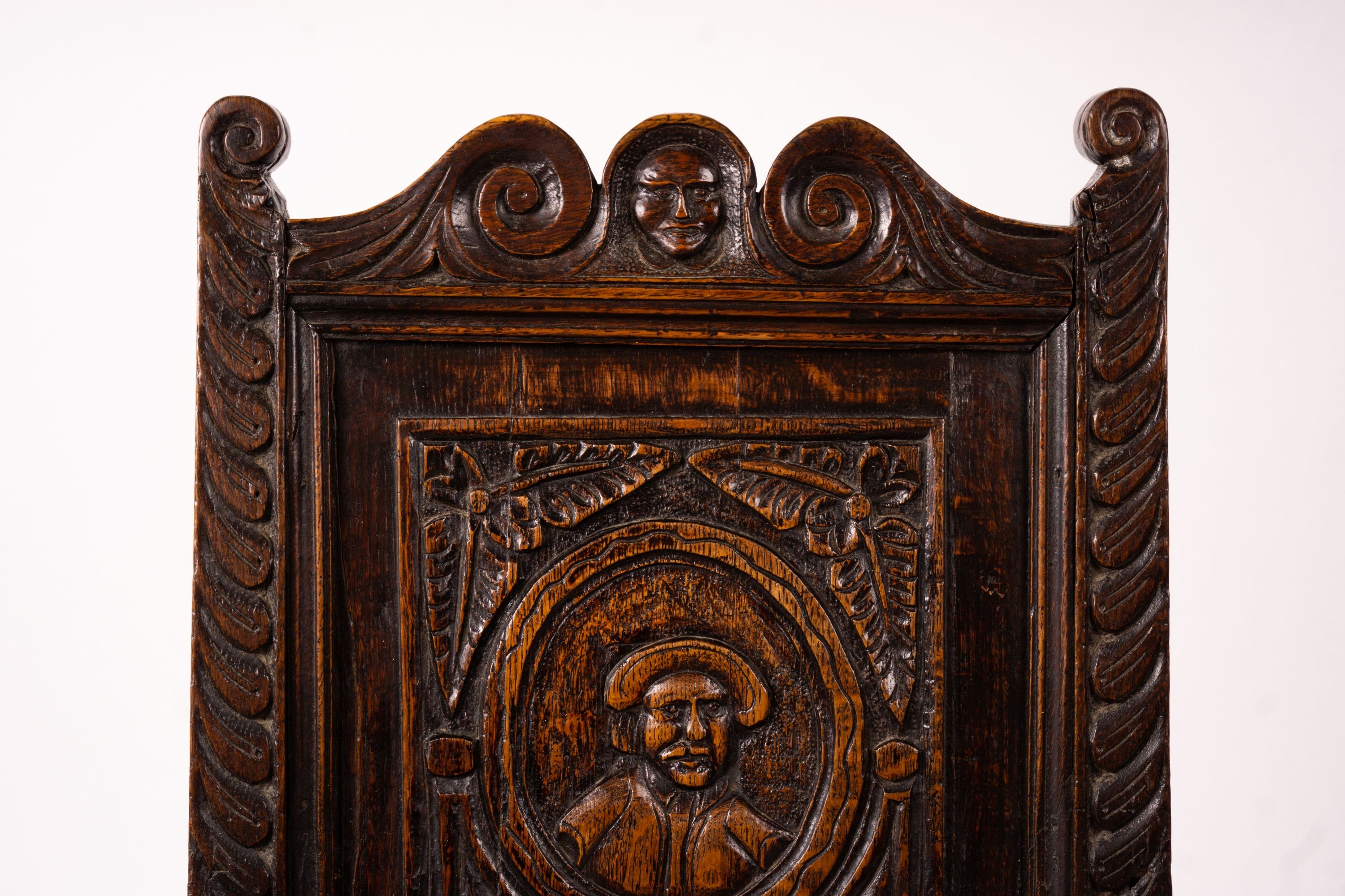 An 18th century style carved oak wainscot chair, width 56cm, depth 60cm, height 101cm